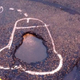 Illustration for article titled Hero Graffiti Artist Gets Potholes Fixed By Drawing Dicks On Them